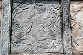 Bangkok Wat Pho. Around the base of the ubosot are 152 stone panels with bas-reliefs which narrate the story of the Ramakien, Thai version of the Hindu Ramayama.  